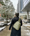 crossbody backpack in shimmer olive green